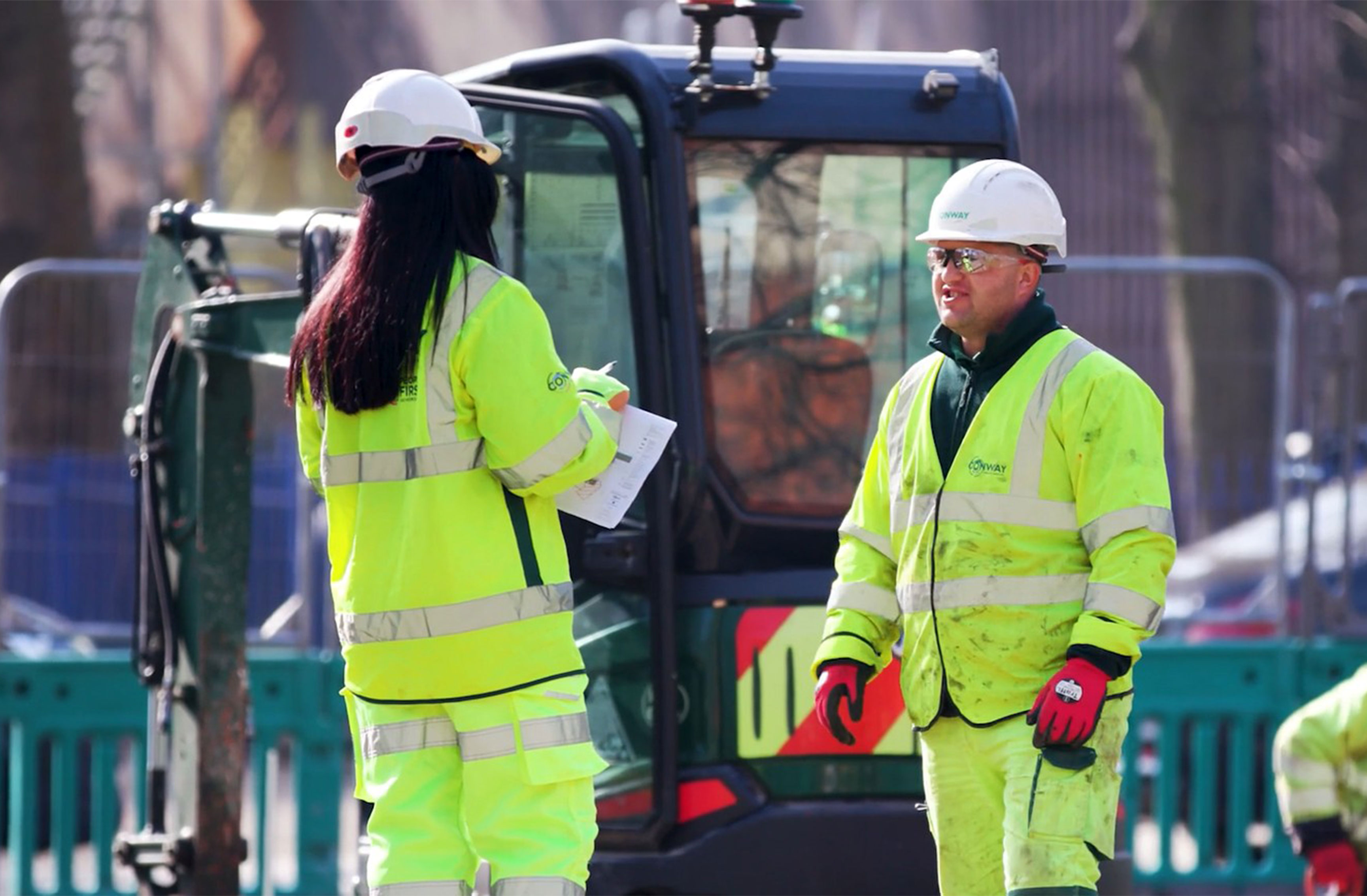 Three Conway workers on site examining the resources