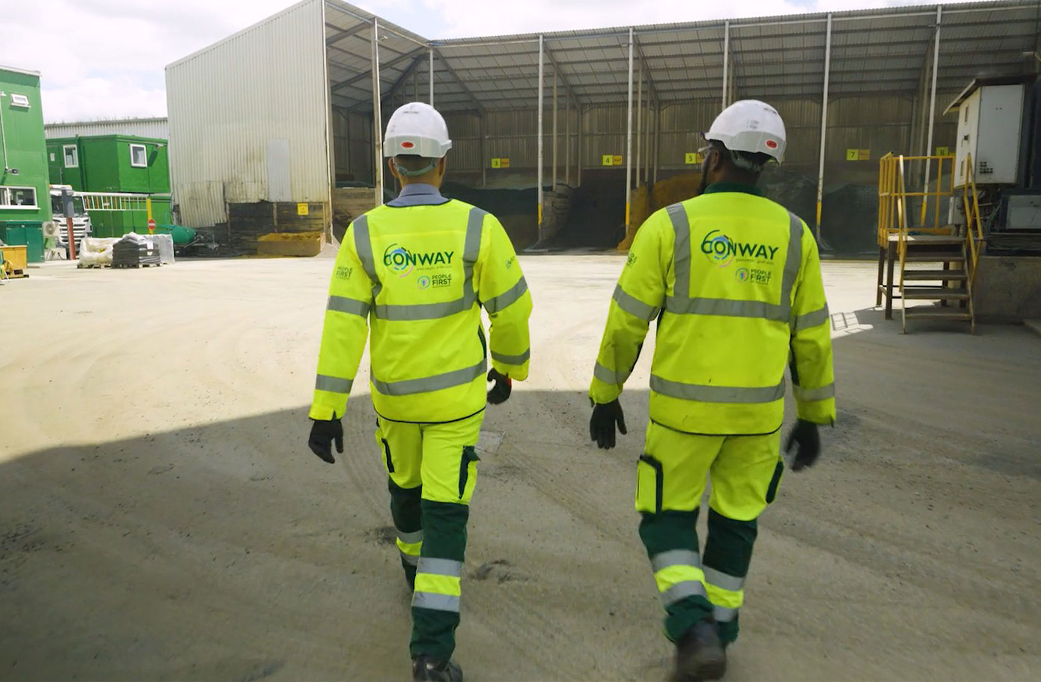 Two Conway workers posing for a photograph